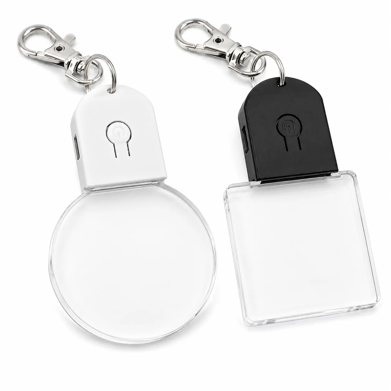 RGB acrylic light-up keychains clipped to a handbag with personalized names